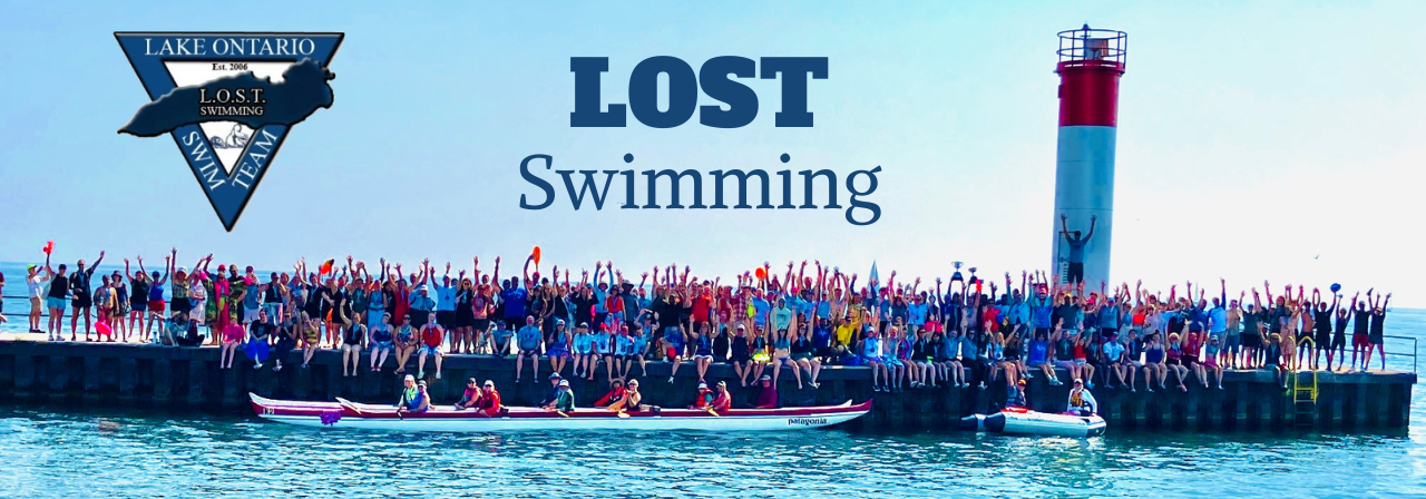 Open water swimming at sunrise in Lake Ontario
